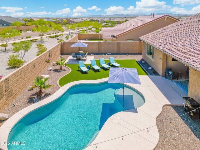 15663 S 183rd Dr, Goodyear, AZ 85338 - view of pool featuring a fenced backyard, a residential view, and a patio