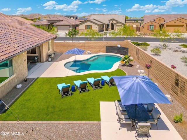 15663 S 183rd Dr, Goodyear, AZ 85338 - view of pool featuring a fenced backyard, a patio area, a residential view, and a fenced in pool