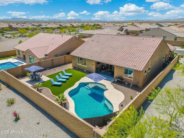 15663 S 183rd Dr, Goodyear, AZ 85338 - view of pool with a residential view, a patio area, and a fenced backyard