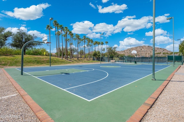15663 S 183rd Dr, Goodyear, AZ 85338 - view of sport court with community basketball court, fence, and a mountain view