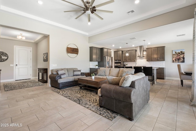 15663 S 183rd Dr, Goodyear, AZ 85338 - living room featuring baseboards, a ceiling fan, visible vents, and recessed lighting