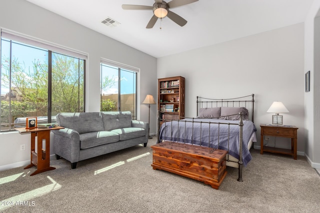 bedroom featuring a ceiling fan, carpet flooring, visible vents, and baseboards