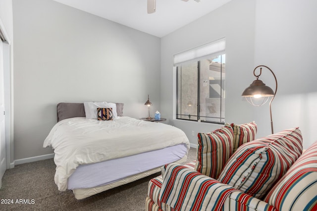 carpeted bedroom with baseboards and ceiling fan