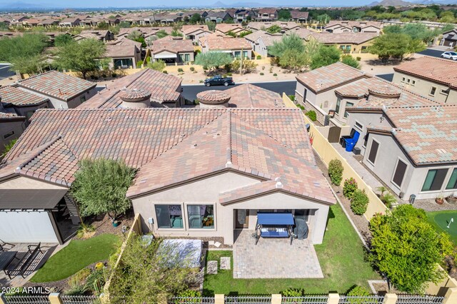 birds eye view of property featuring a mountain view