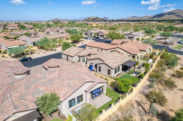 birds eye view of property with a mountain view and a residential view