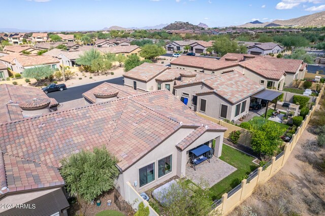drone / aerial view with a residential view and a mountain view