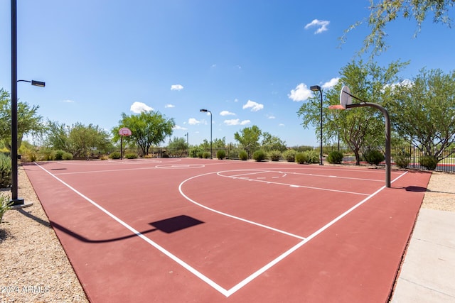 view of basketball court featuring community basketball court and fence