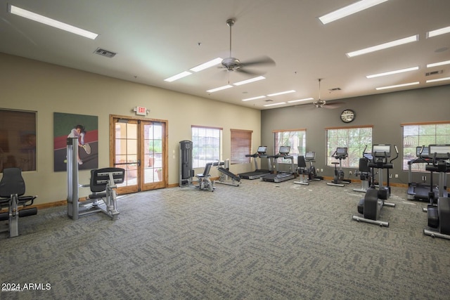 exercise room featuring baseboards, carpet, visible vents, and ceiling fan