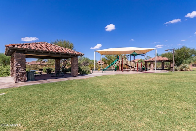 view of community with a gazebo, a lawn, and playground community