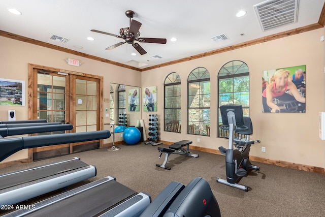 gym with a ceiling fan, visible vents, and ornamental molding
