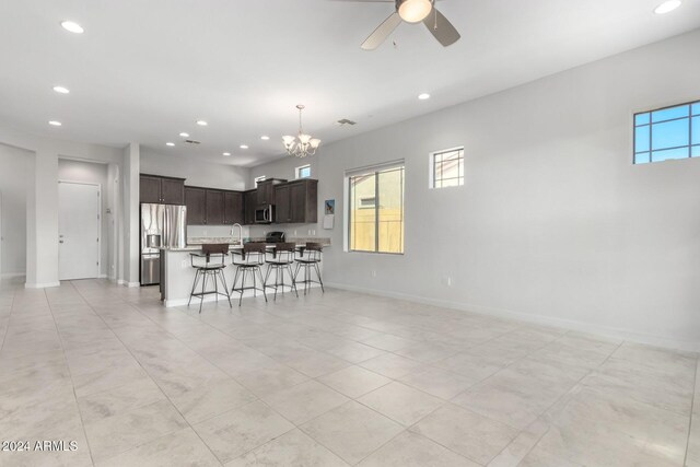 bathroom featuring ceiling fan, tile patterned floors, an enclosed shower, and vanity