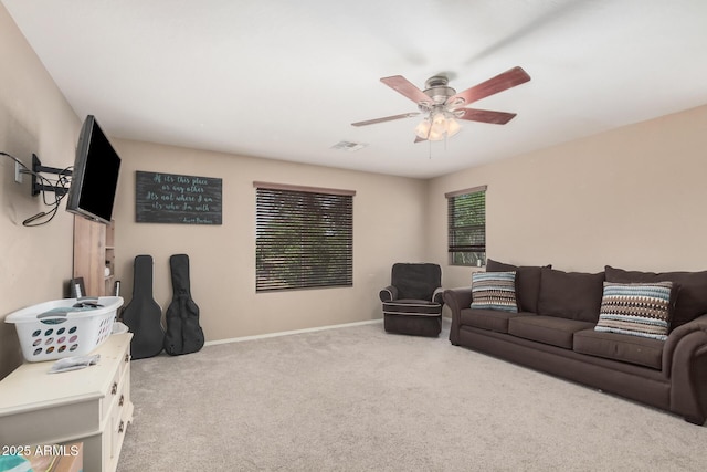 2748 E Dennisport Ave, Gilbert, AZ 85295 - carpeted living area with ceiling fan and baseboards