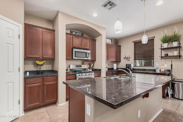 2748 E Dennisport Ave, Gilbert, AZ 85295 - kitchen with appliances with stainless steel finishes, a sink, light tile patterned flooring, open shelves, and dark stone countertops