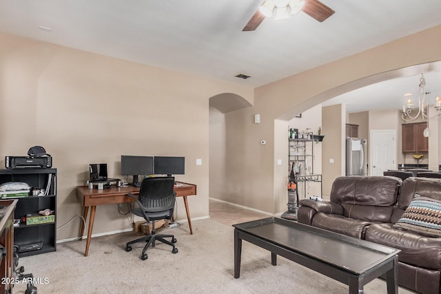 2748 E Dennisport Ave, Gilbert, AZ 85295 - home office with arched walkways, light colored carpet, ceiling fan, and baseboards