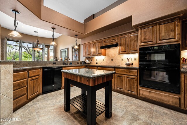 kitchen with decorative backsplash, a peninsula, black appliances, pendant lighting, and a sink