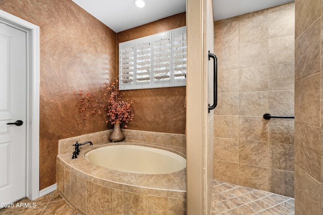 full bathroom featuring a tile shower, tile patterned flooring, and a garden tub