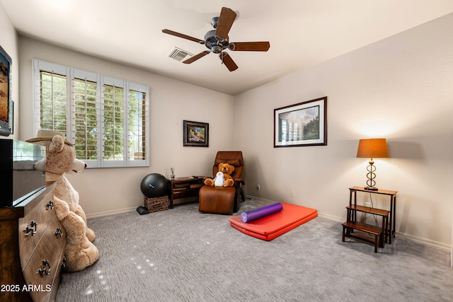 living area with a ceiling fan, carpet, visible vents, and baseboards