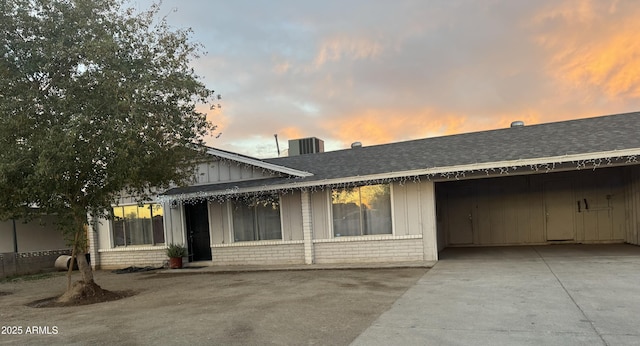 view of front of house featuring cooling unit