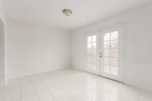 3042 N 87th Ave, Phoenix, AZ 85037 - empty room with french doors and baseboards