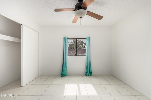 3042 N 87th Ave, Phoenix, AZ 85037 - unfurnished bedroom featuring a textured ceiling and a ceiling fan