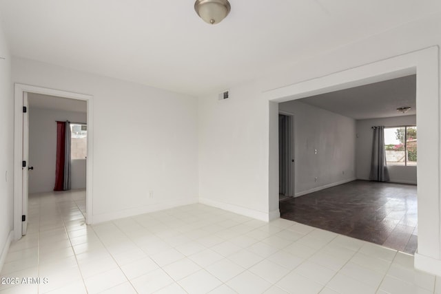 3042 N 87th Ave, Phoenix, AZ 85037 - unfurnished room with light tile patterned flooring and baseboards