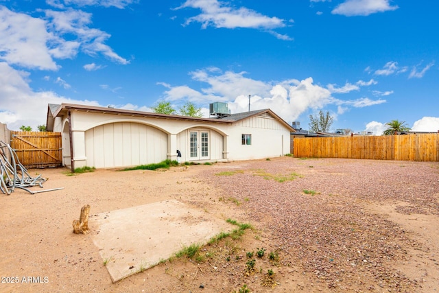 3042 N 87th Ave, Phoenix, AZ 85037 - back of house featuring french doors and a fenced backyard
