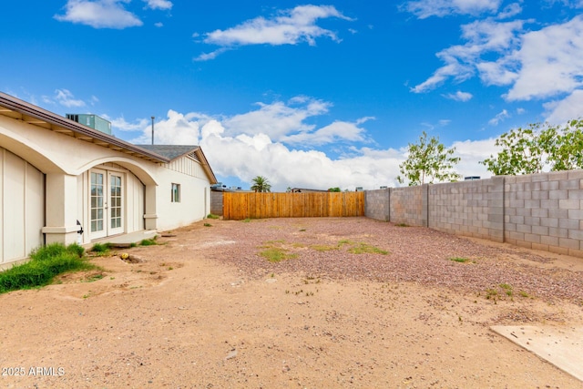 3042 N 87th Ave, Phoenix, AZ 85037 - fenced backyard featuring french doors