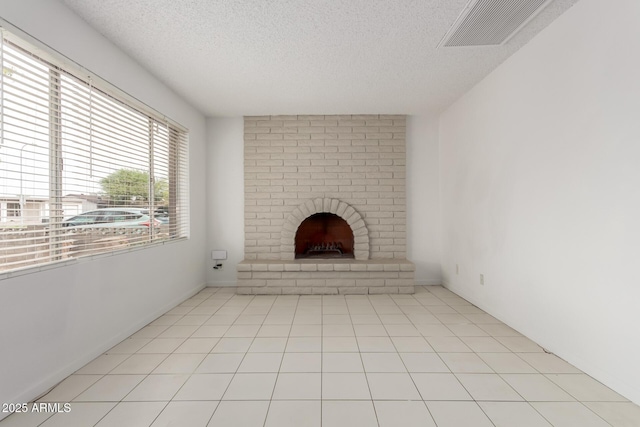 3042 N 87th Ave, Phoenix, AZ 85037 - unfurnished living room with a textured ceiling and a fireplace
