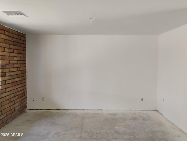 2435 E 13th St, Douglas, AZ 85607 - unfurnished room with concrete flooring and brick wall