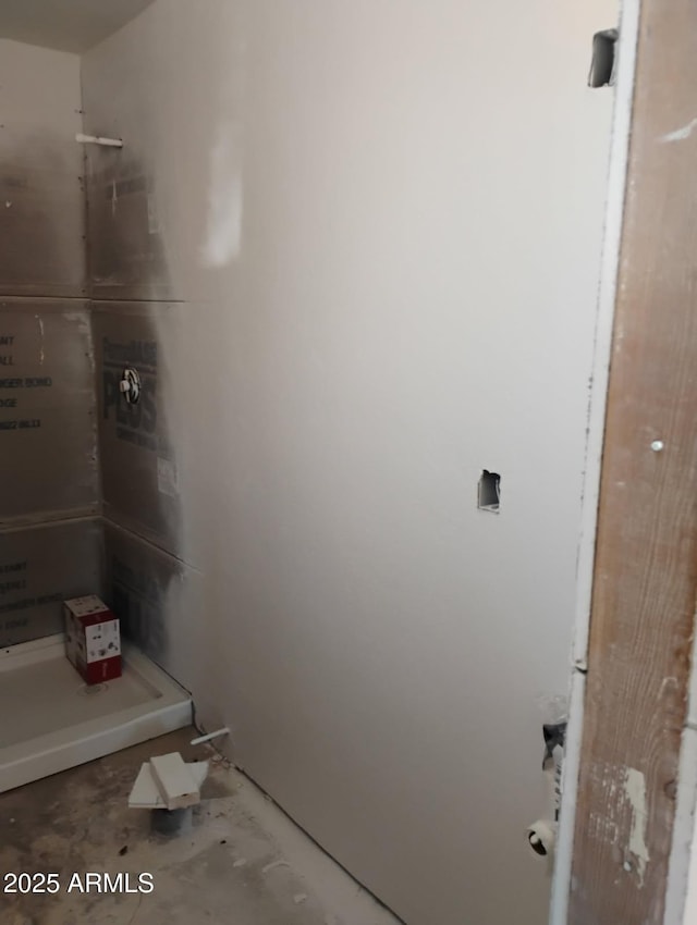 2435 E 13th St, Douglas, AZ 85607 - full bathroom featuring a shower stall and unfinished concrete flooring