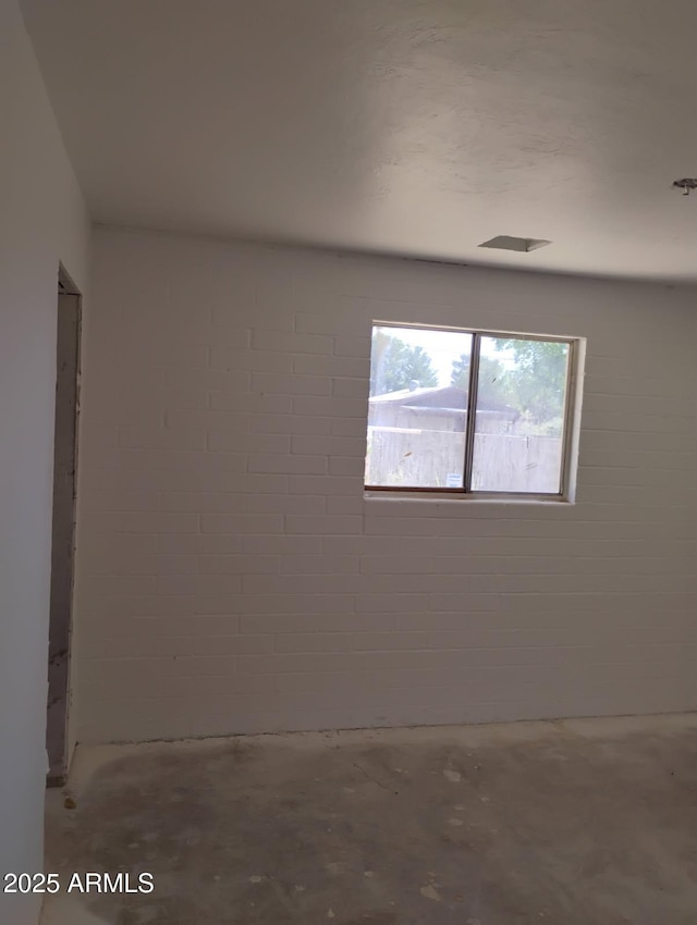 2435 E 13th St, Douglas, AZ 85607 - empty room featuring unfinished concrete flooring