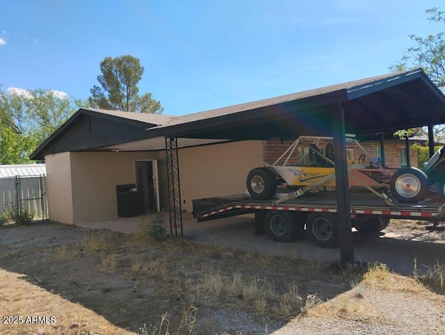 2435 E 13th St, Douglas, AZ 85607 - view of side of home with a carport