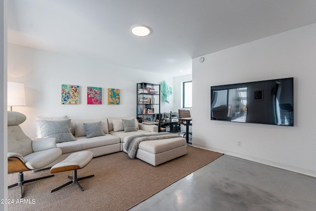 living room with concrete flooring