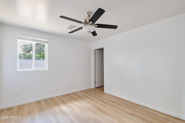 751 E Southern Ave, Phoenix, AZ 85040 - unfurnished room with light wood-style floors, baseboards, a ceiling fan, and visible vents