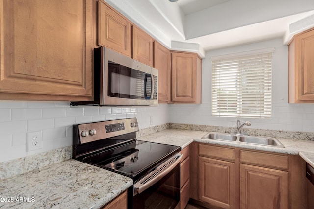 1825 W Ray Rd Unit 1070, Chandler, AZ 85224 - kitchen featuring appliances with stainless steel finishes, a sink, tasteful backsplash, and light stone counters