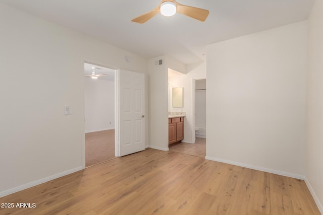 1825 W Ray Rd Unit 1070, Chandler, AZ 85224 - unfurnished bedroom featuring light wood-style floors, baseboards, connected bathroom, and ceiling fan