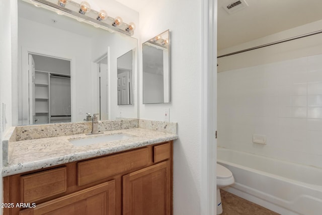 1825 W Ray Rd Unit 1070, Chandler, AZ 85224 - full bathroom with toilet, vanity, shower / bathtub combination, tile patterned floors, and a walk in closet
