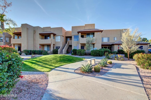 1825 W Ray Rd Unit 1070, Chandler, AZ 85224 - view of front of property with stucco siding, a front yard, and a tile roof