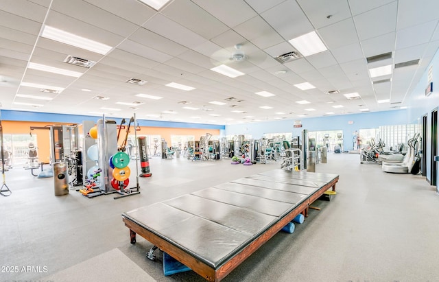 workout area featuring visible vents and a drop ceiling