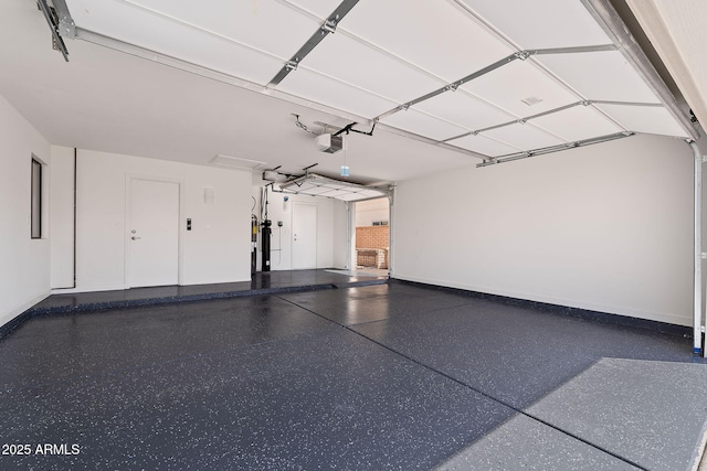 garage featuring baseboards and a garage door opener