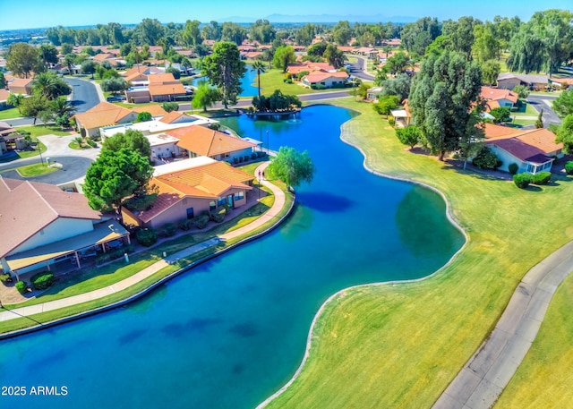 bird's eye view with a residential view and a water view