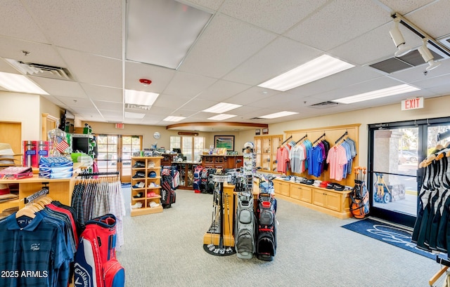 misc room featuring visible vents, a paneled ceiling, and carpet flooring