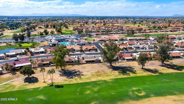 aerial view featuring view of golf course, a mountain view, and a residential view