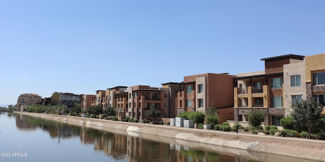 view of building exterior with a water view