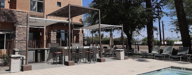 view of pool featuring fence and a patio area