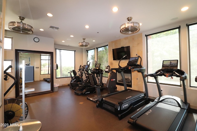 gym with recessed lighting and baseboards