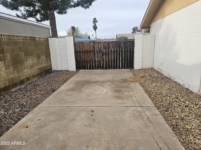 view of gate with fence private yard