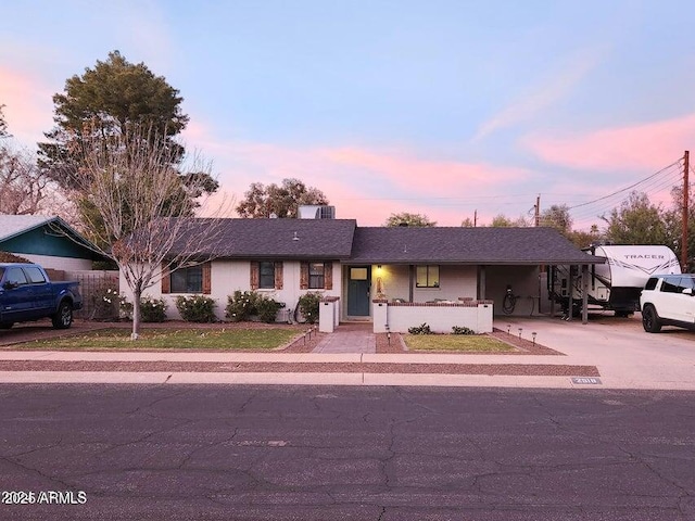 2518 E Flower St E, Phoenix, AZ 85016 - ranch-style house featuring concrete driveway and an attached carport
