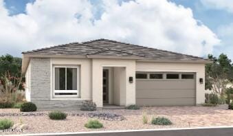 15824 W Miami St, Goodyear, AZ 85338 - prairie-style house featuring driveway, a garage, and stucco siding
