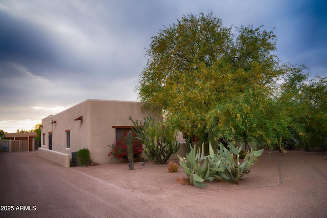 2430 N 56th St, Phoenix, AZ 85008 - view of front of property featuring stucco siding and fence